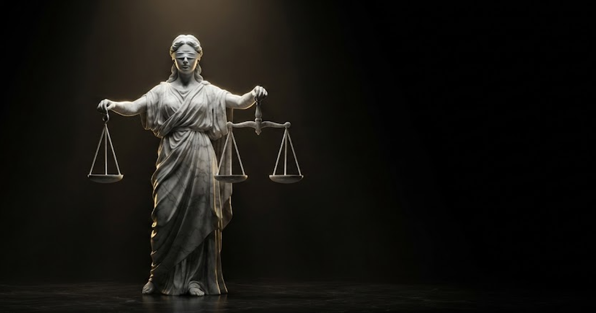 A blindfolded marble statue of Themis holding perfectly balanced scales under even gold light in darkness