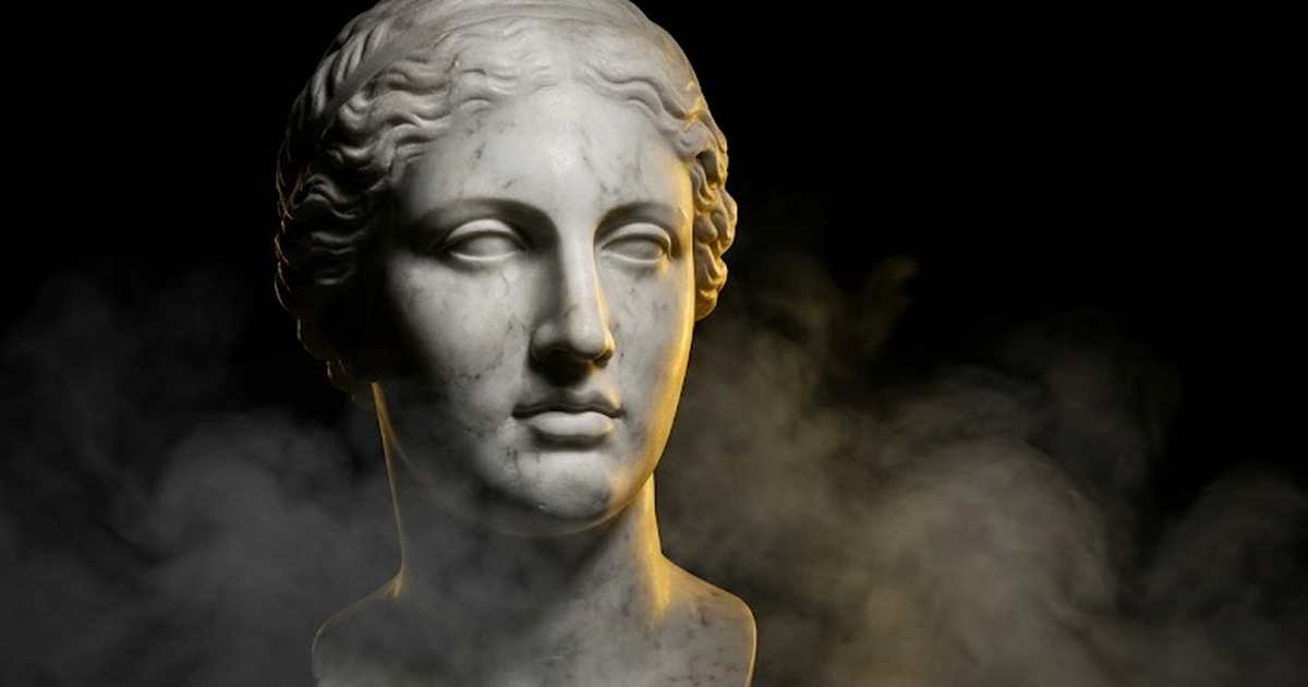 A marble bust of the Delphic Oracle, gold light catching one side of the face while the other falls into deep shadow, surrounded by dark negative space.