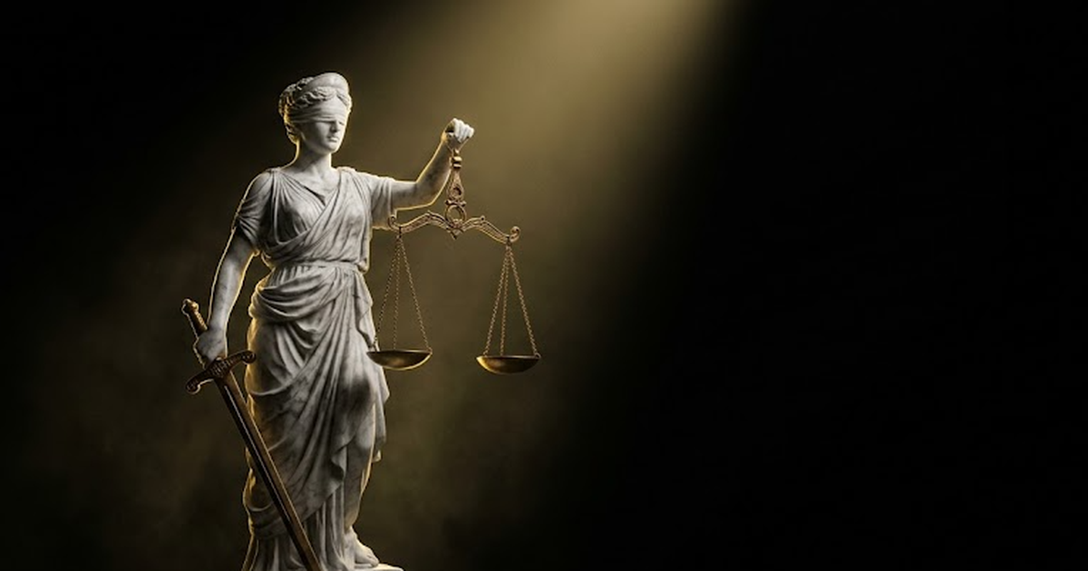 Themis, goddess of justice, sculpted in white marble holding level scales, one pan dipping under invisible weight, illuminated by a single shaft of gold light in deep darkness
